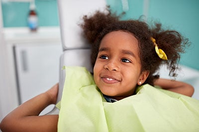 smiling girl at first dental visit